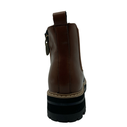 Back view of light brown leather boot with chunky black heel