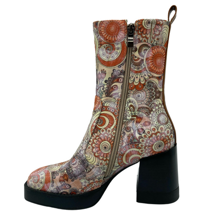 Left facing view of retro floral print short boot with side zipper closure and block heel