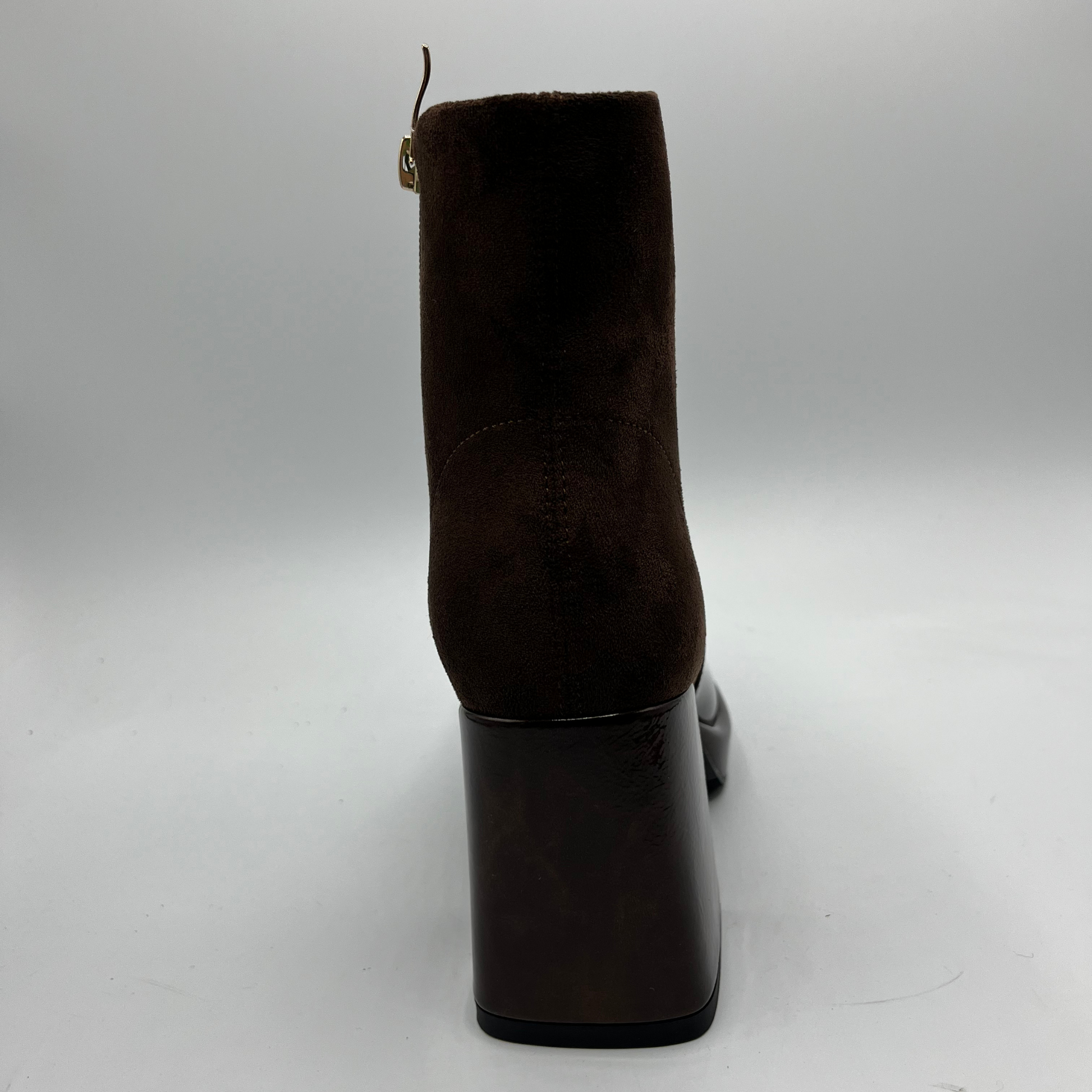 Brown suede ankle boot on a white background