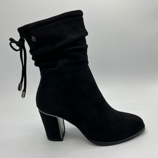 Black ankle boot with a block heel on a white background
