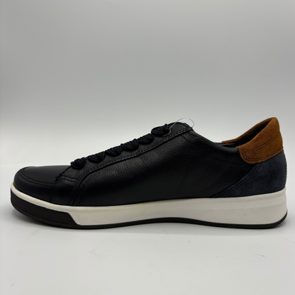 A leather low-top sneaker with a thick white platform sole, black laces, and a brown suede heel accent, shown in a side profile on a light gray background.