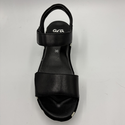Black sandal with 'ara' branding on a light gray background