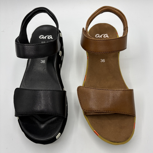 Black and brown sandals with 'ara' branding on a white background