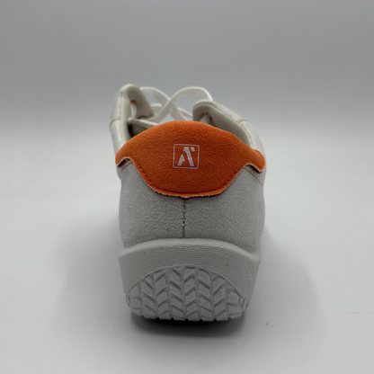 Gray sneaker with orange patch and logo on a white background