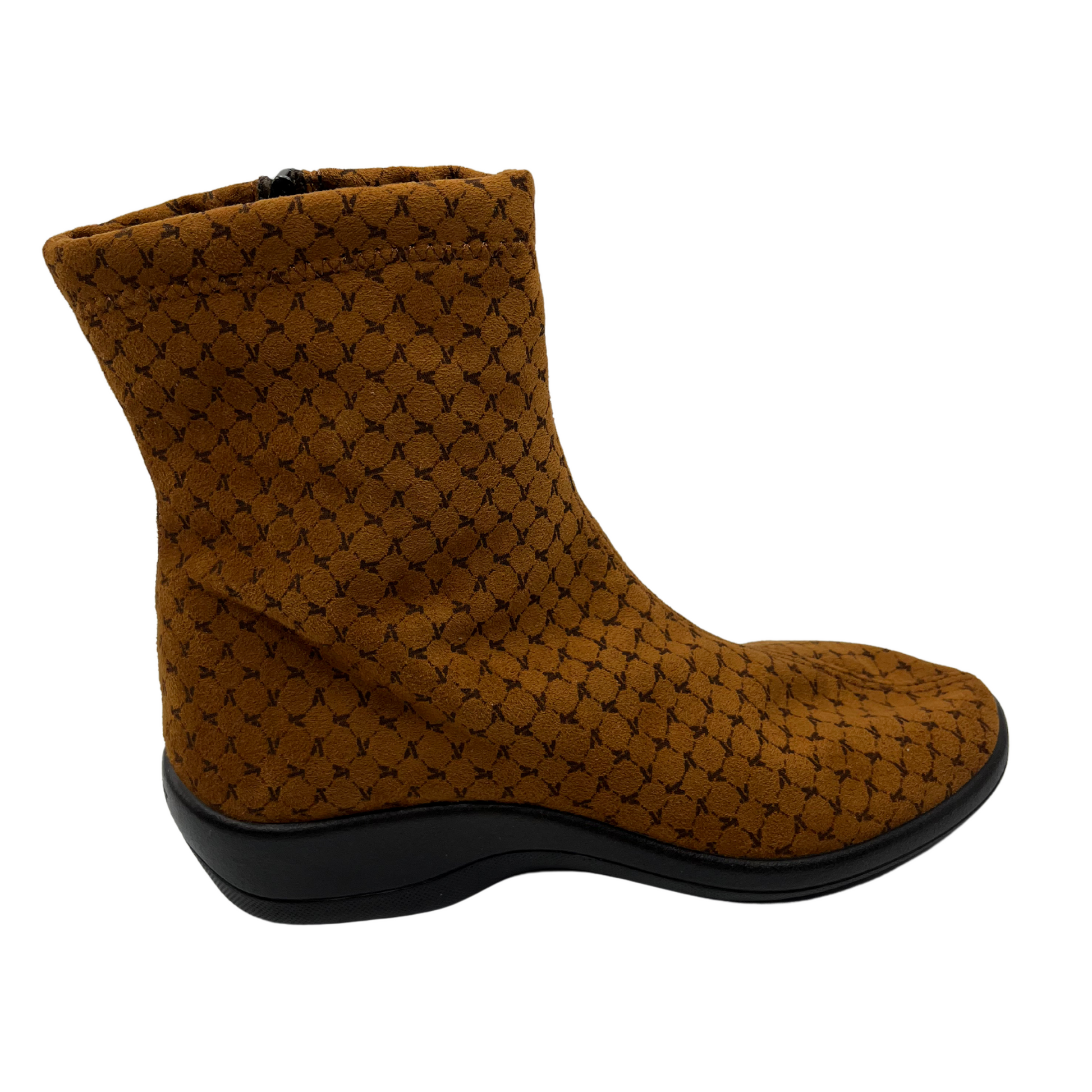 Right facing view of tobacco short boot with black outsole. Side zipper closure and rounded toe.