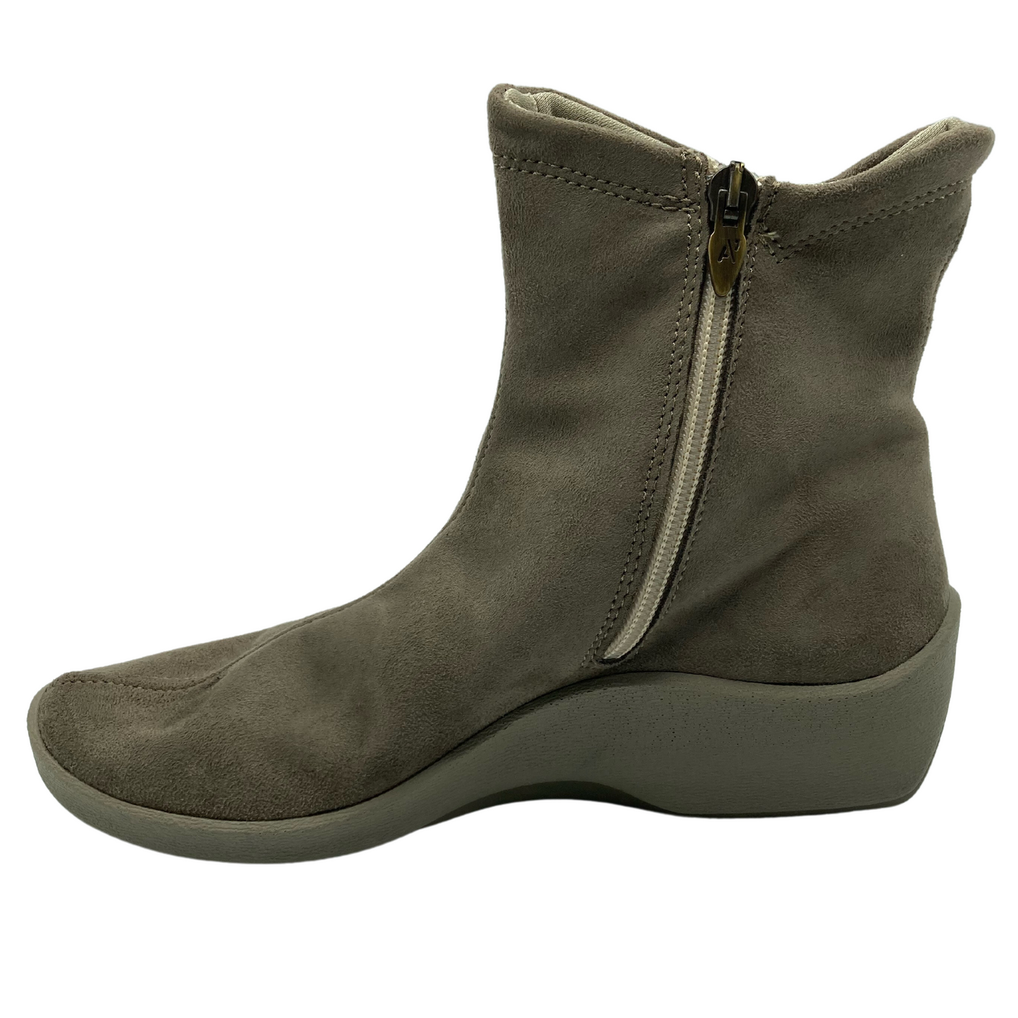 Left facing view of faux suede short boot with inner side zipper and rubber outsole