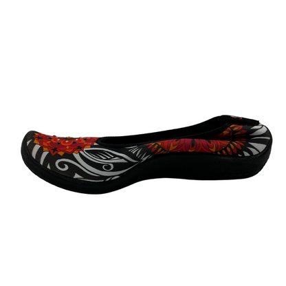 Left view of ballet flat with floral pattern on stretchy upper.