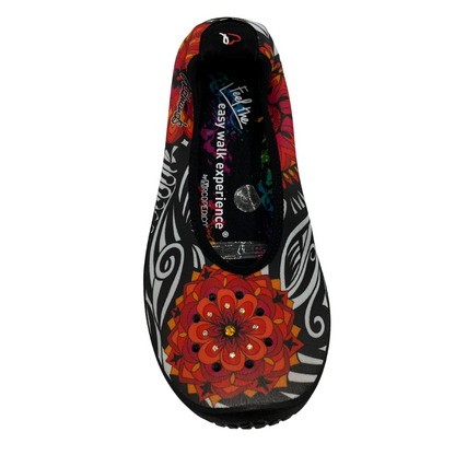 Top view of ballet flat with floral pattern on stretchy upper.