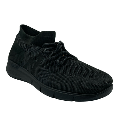 45 degree angled view of black mesh sneaker with black rubber sole and laces