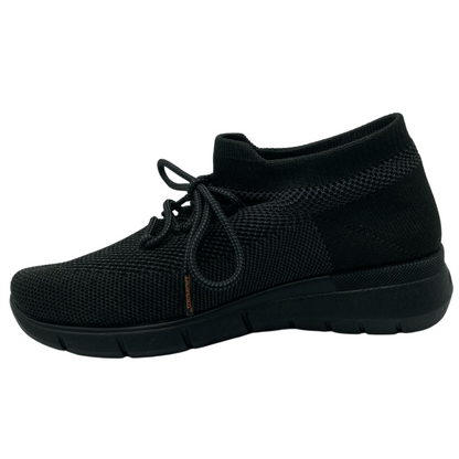 Left facing view of black mesh sneaker with black rubber outsole and laces
