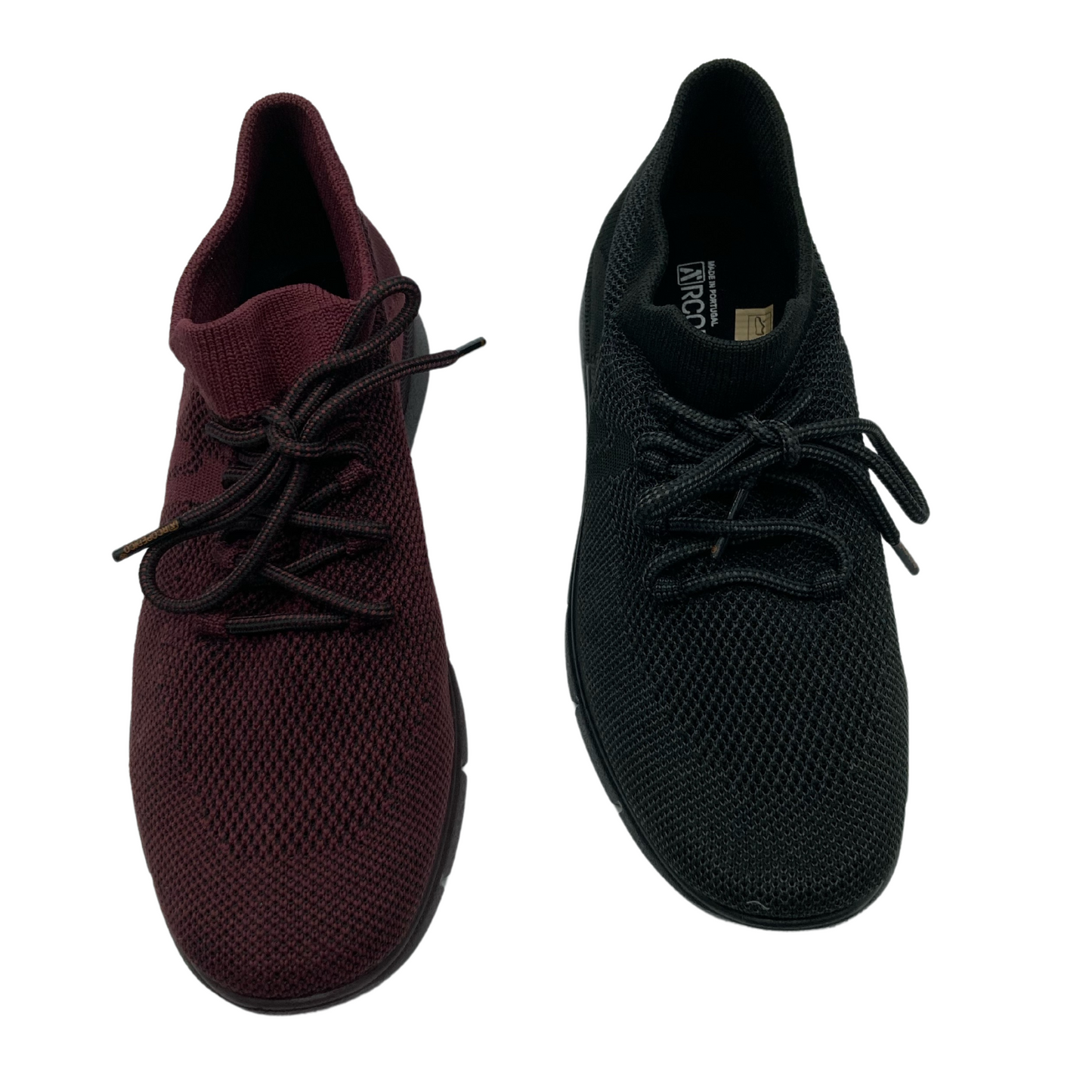 Top view of a pair of mesh sneakers, the one on the left is burgundy and the one on the right is black. Both have matching laces