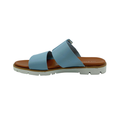 Inside view of a slip on sandal.  Shown in a baby blue color.  Two wide straps
