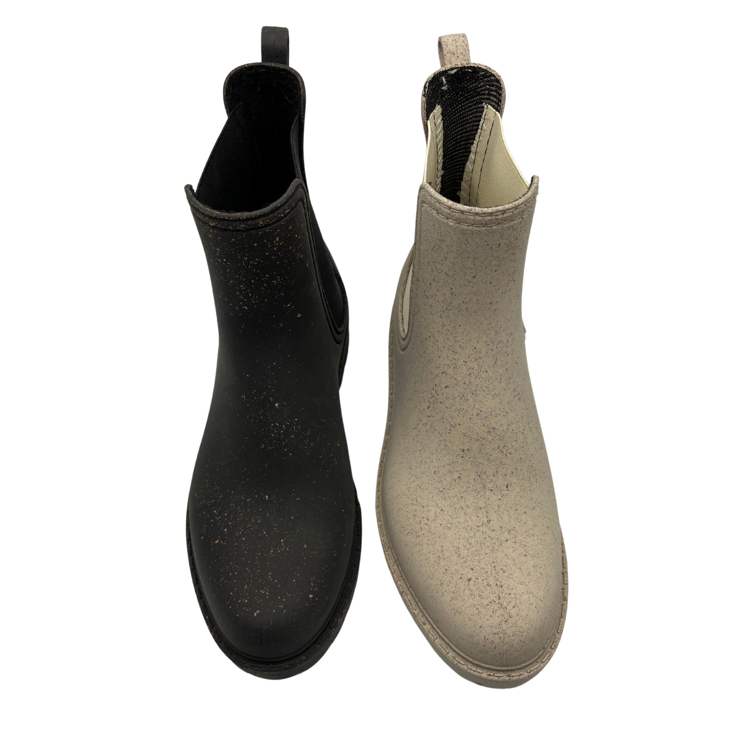 Top view of two short boots beside each other. One is black and the other is natural beige. Both have elasticated side gores and a pull on heel tab.