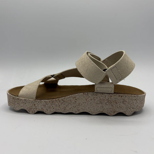 Beige sandal with cork sole on a white background