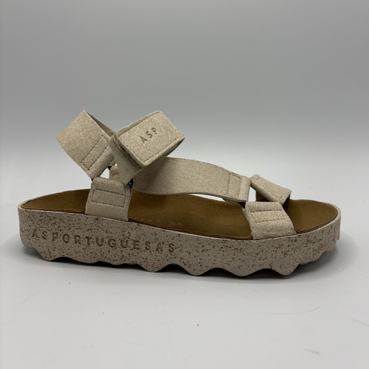 Beige sandal with multiple straps on a white background