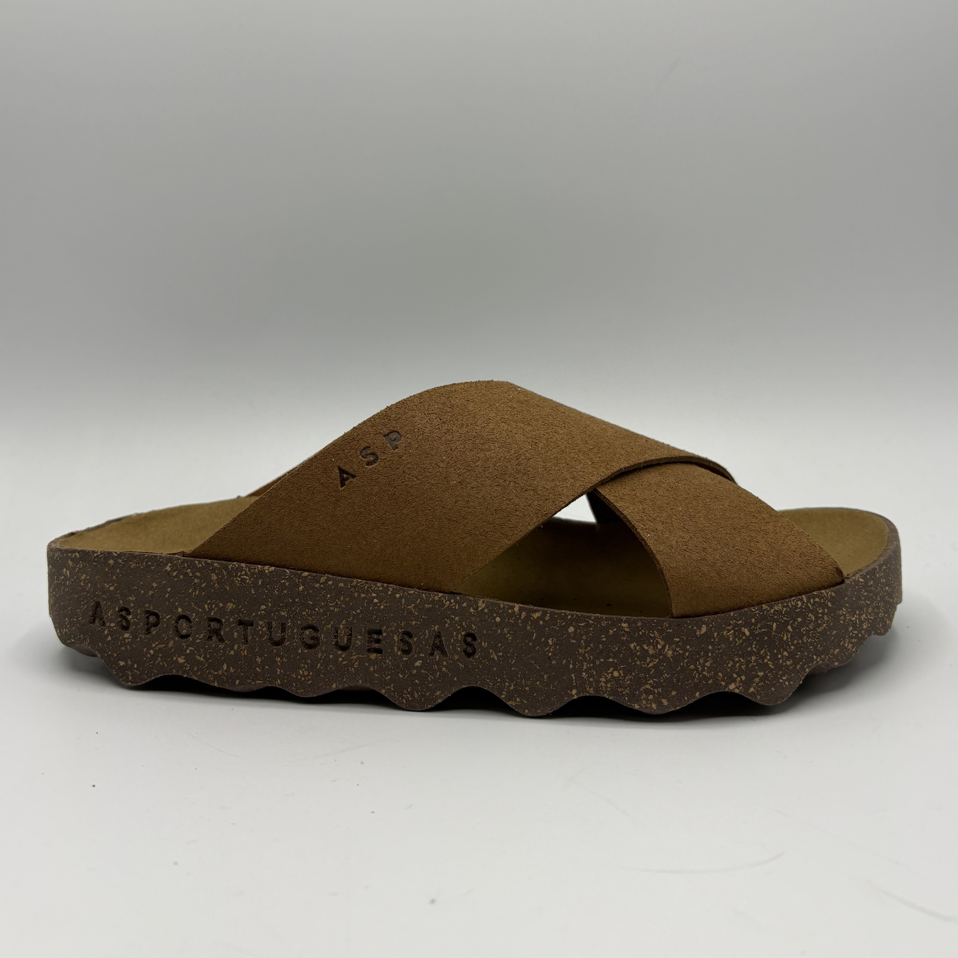Brown sandal with cork sole on a white background