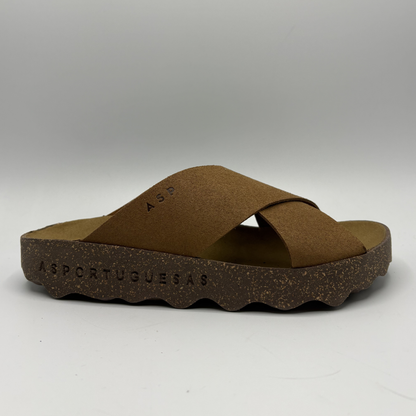Brown sandal with cork sole on a white background