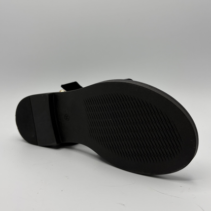 Black sandal sole on a gray background