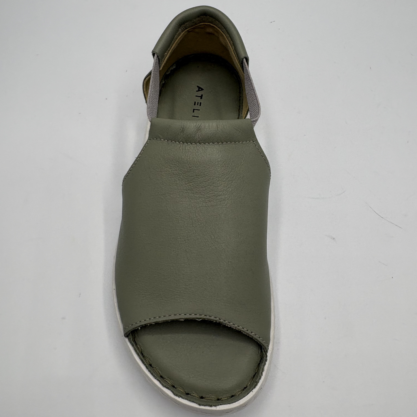Green sandal on a white background