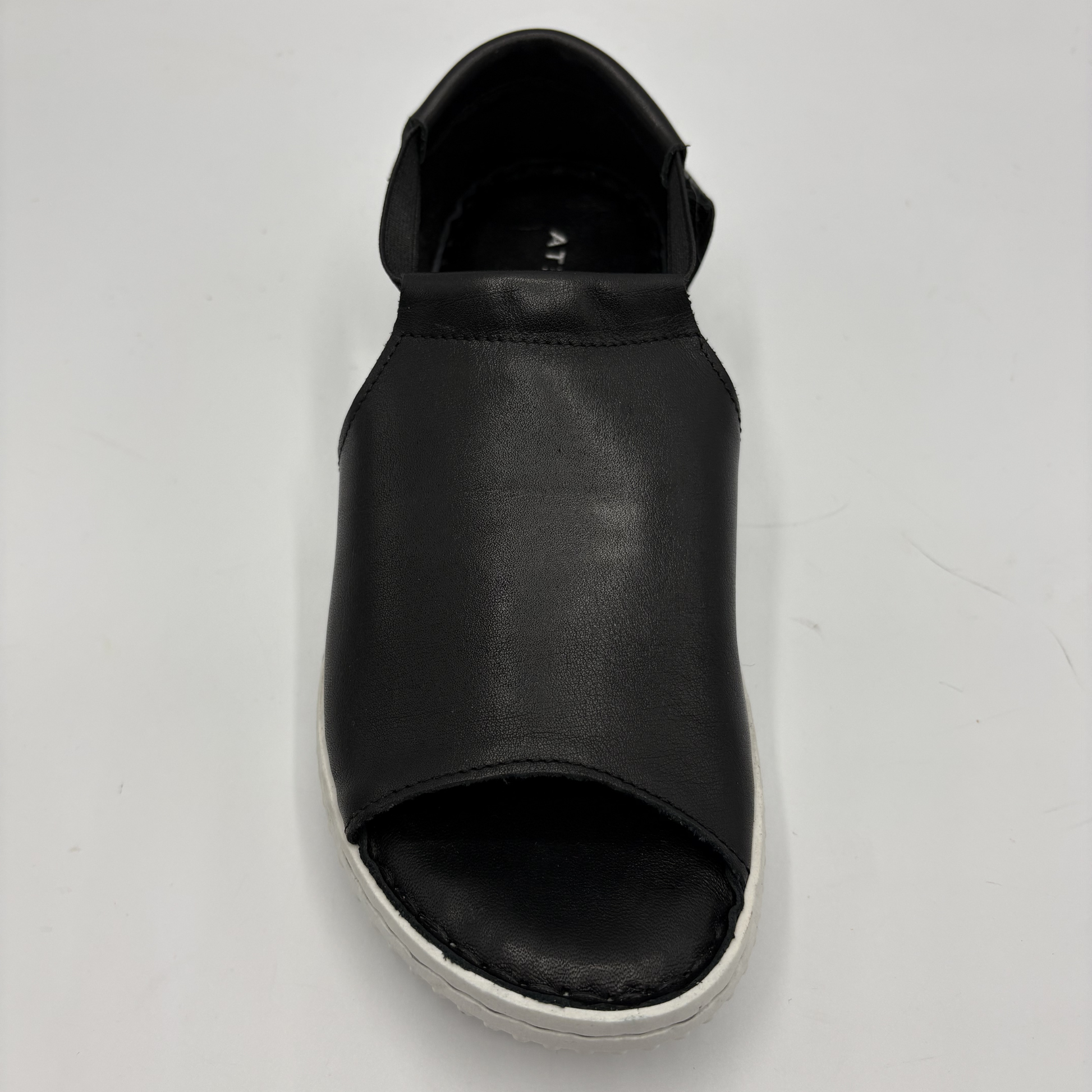 Black sandal on a light gray background