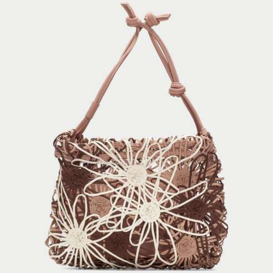 Front view of a woven floral bag