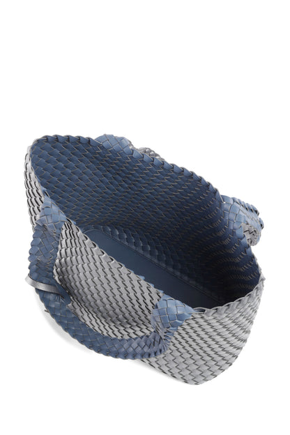 Blue and gray woven bag on a white background