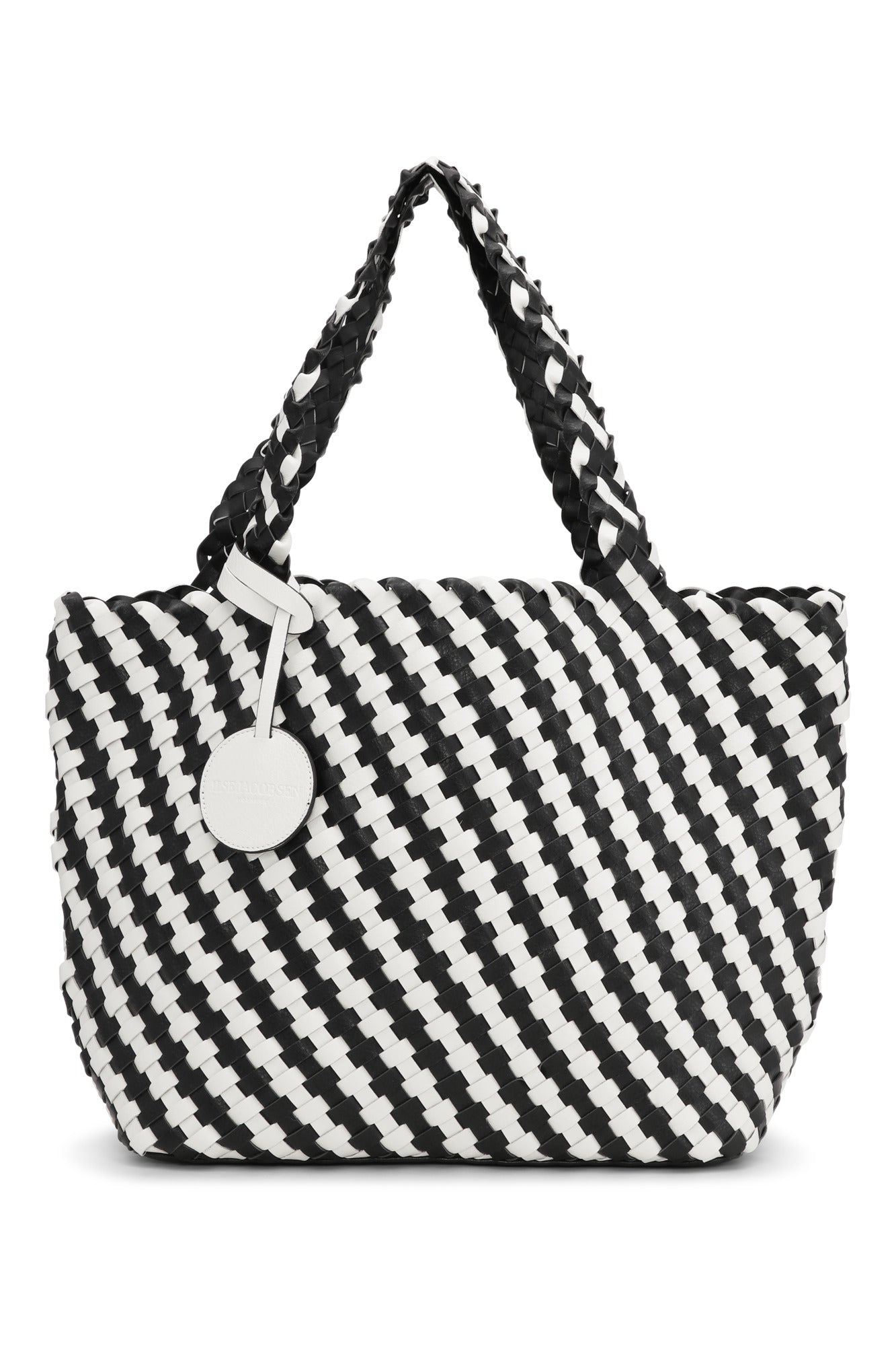 Black and white striped bag with a circular tag on a white background