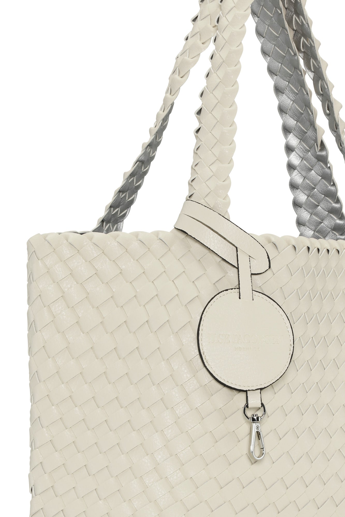 Beige woven handbag with braided handles on a white background