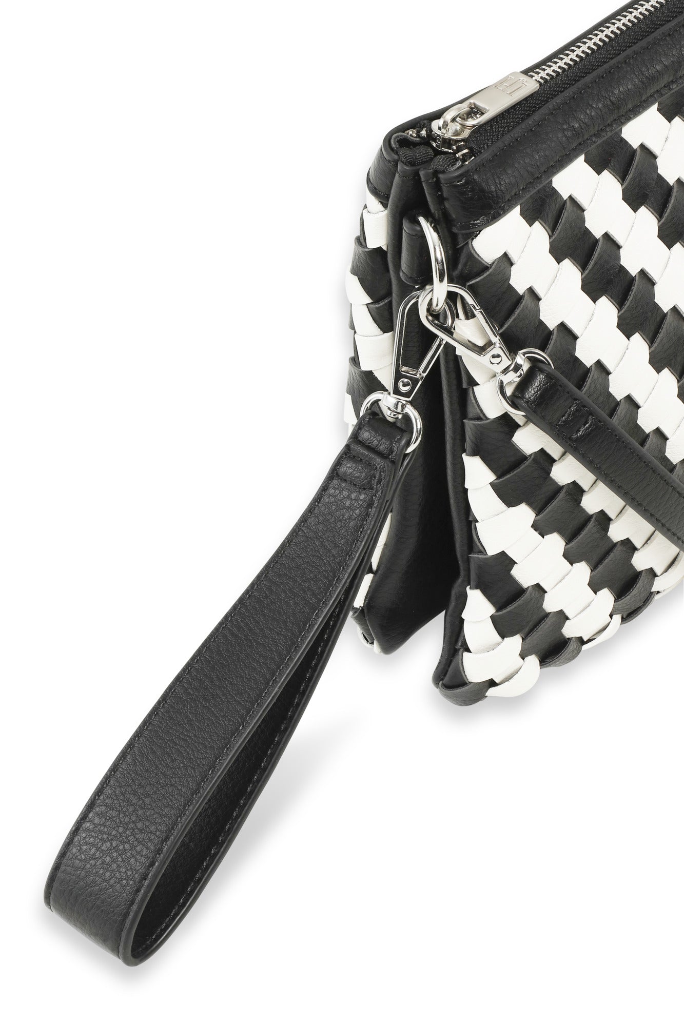 Black and white woven handbag with a strap on a white background