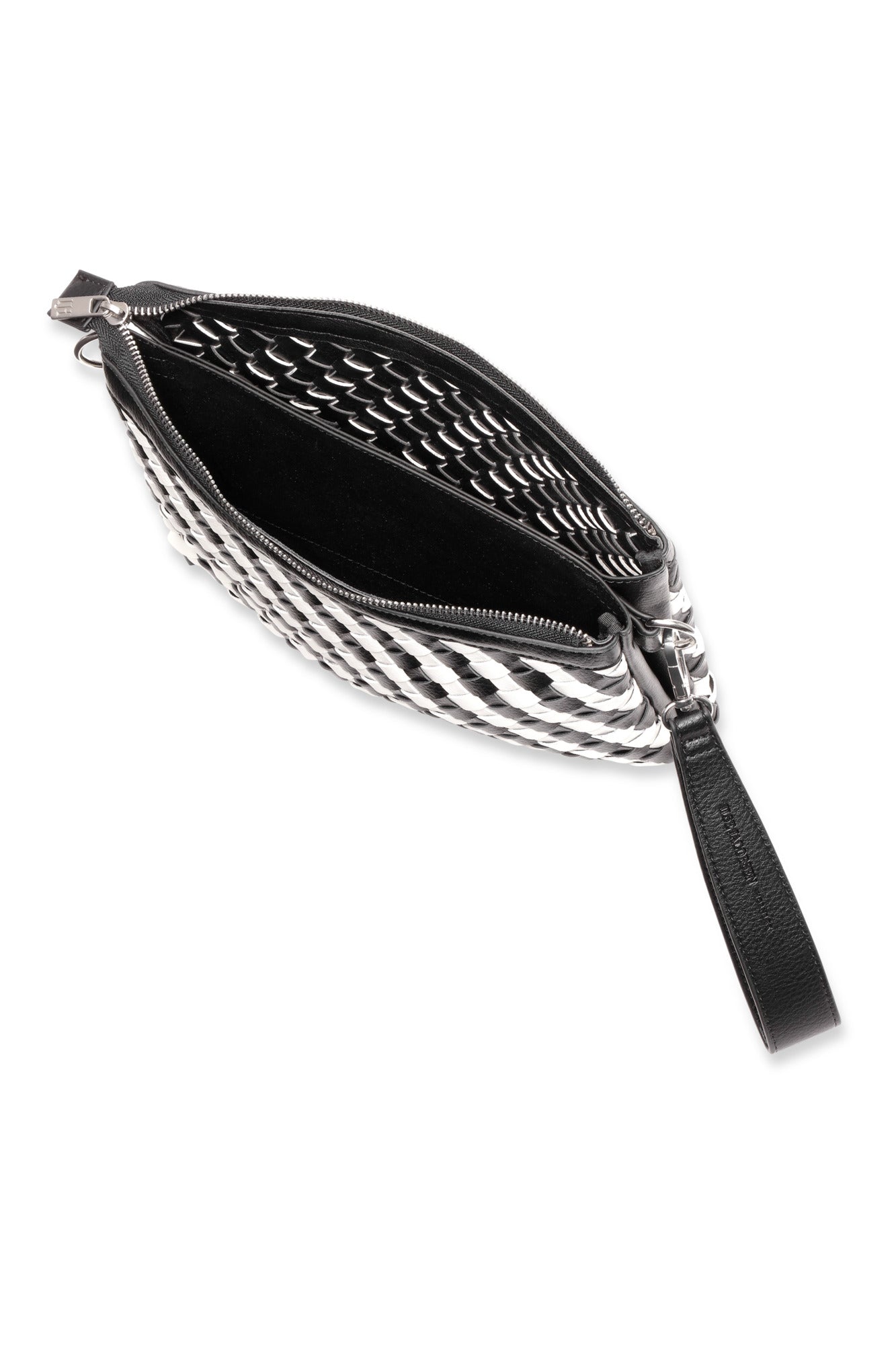 Black and white woven crossbody bag with a strap on a white background