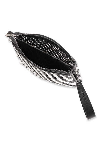 Black and white woven crossbody bag with a strap on a white background