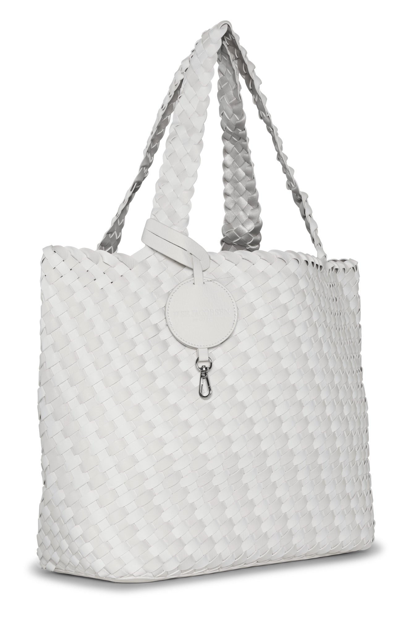 White woven tote bag with a silver clasp on a white background
