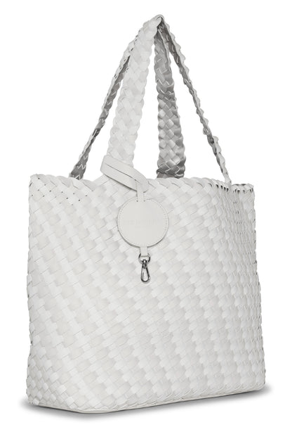 White woven tote bag with a silver clasp on a white background