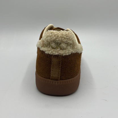 Brown slipper with white fur lining on a white background
