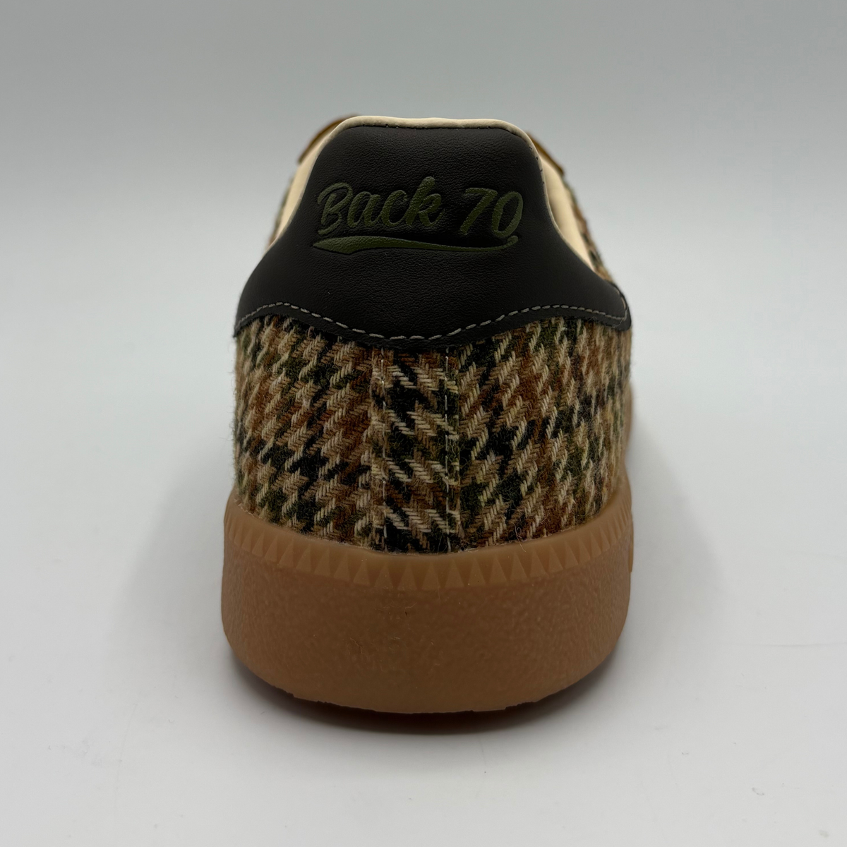 Back view of a brown houndstooth patterned sneaker with a gum outsole