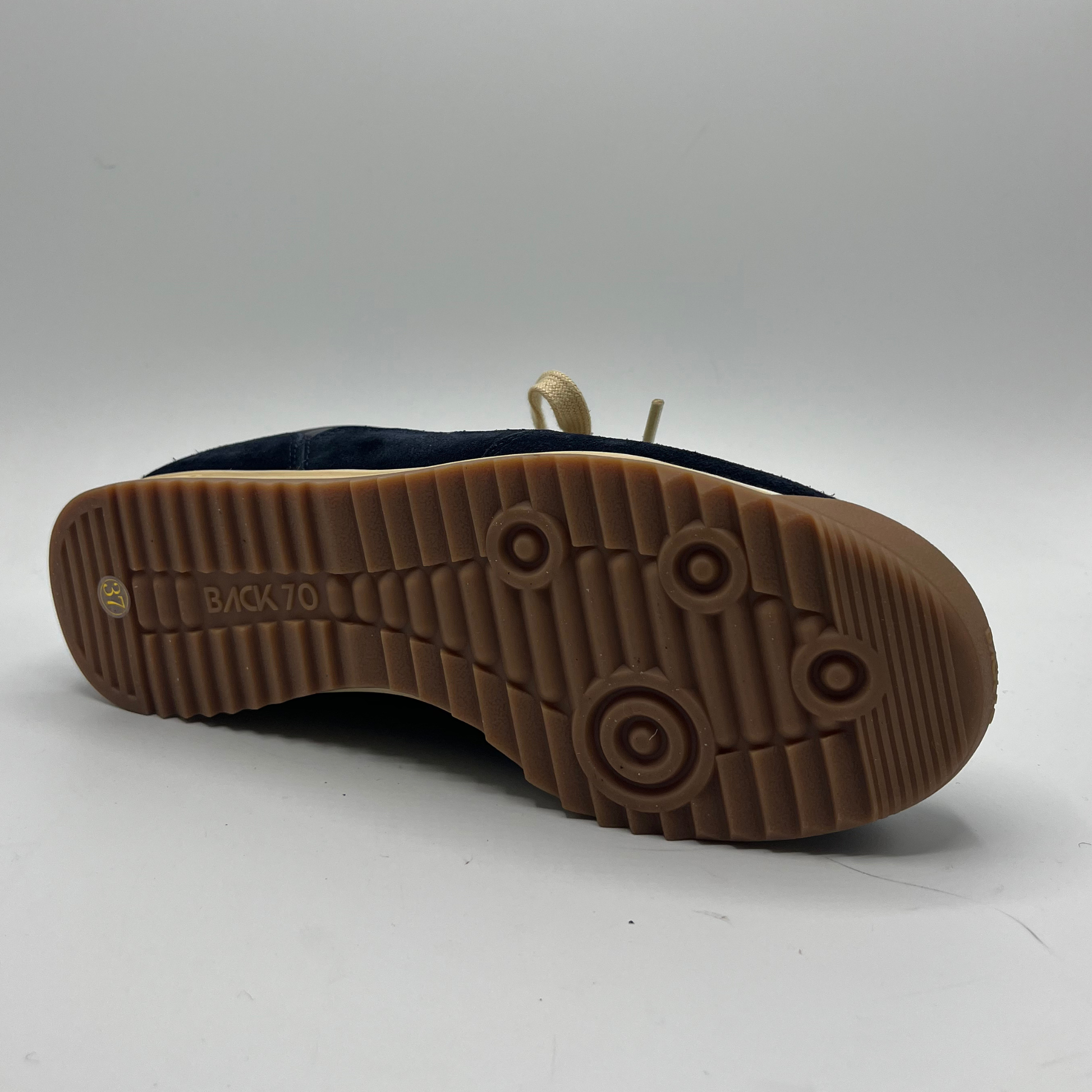 Brown sole of a shoe on a white background