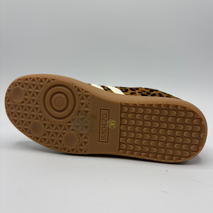 A low-top sneaker featuring a brown and black leopard print pattern on the upper, cream-colored “70”, a cream collar lining, and a brown gum sole with 'BACK 70' embossed on the heel.