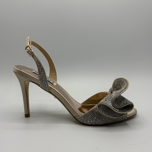 High-heeled sandal with decorative straps on a gray background