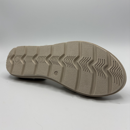 Close-up of a shoe sole with tread pattern on a white background