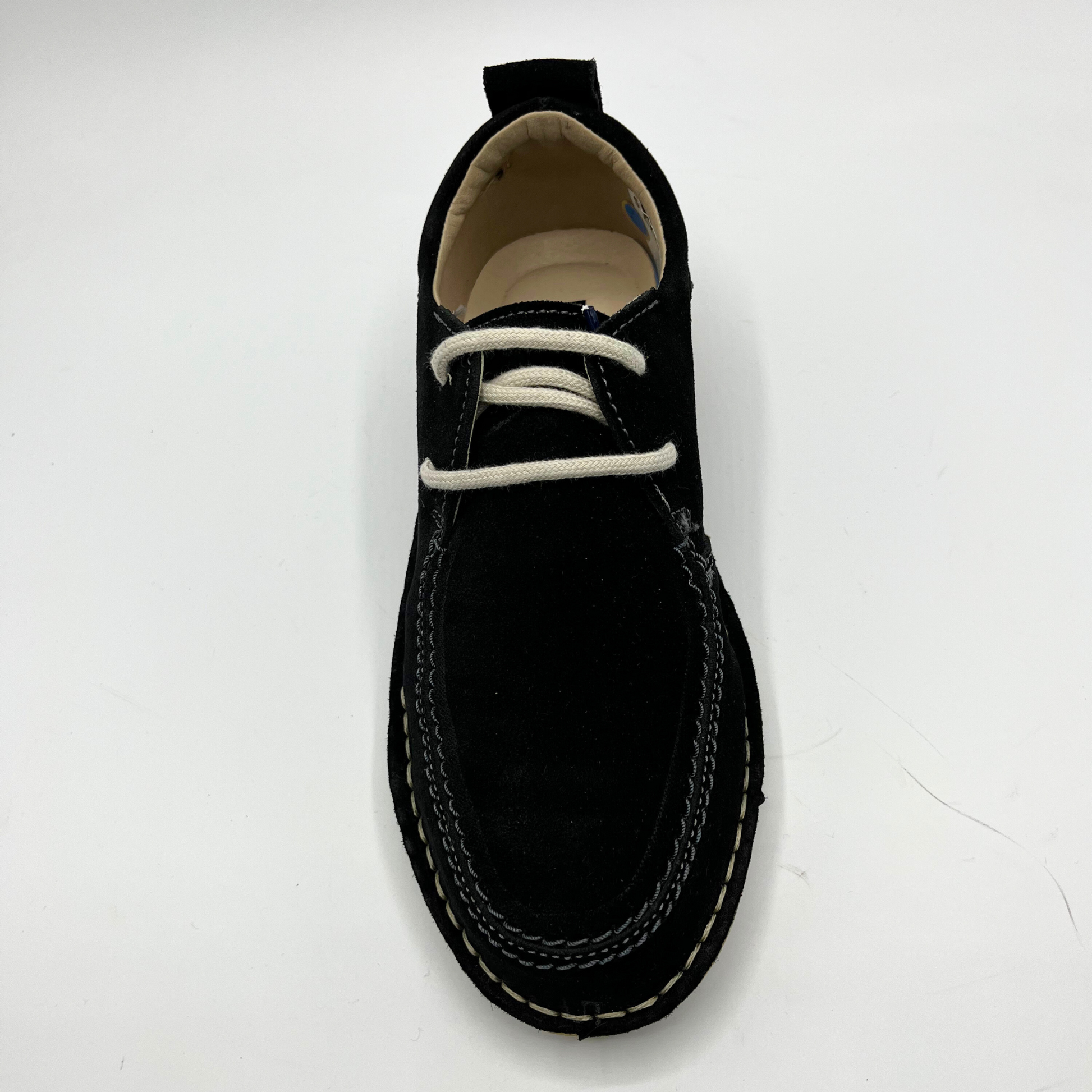Black shoe with white laces on a white background