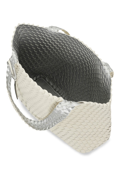 A woven tote bag on a white background