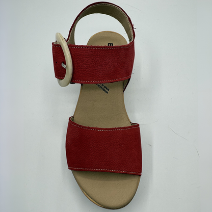 Red sandal with a beige insole on a white background