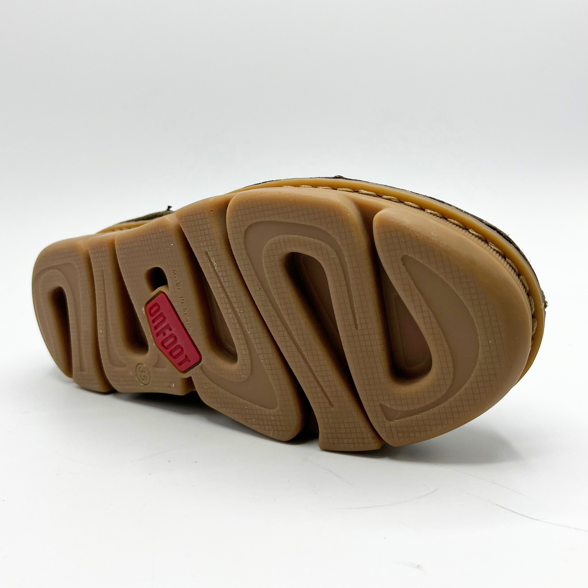 Close-up of a shoel sole with brand logo on a white background