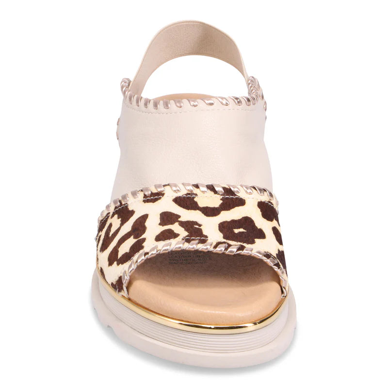 Front of beige Django & Juliette Carlenet sandal with leopard print strap on a white background