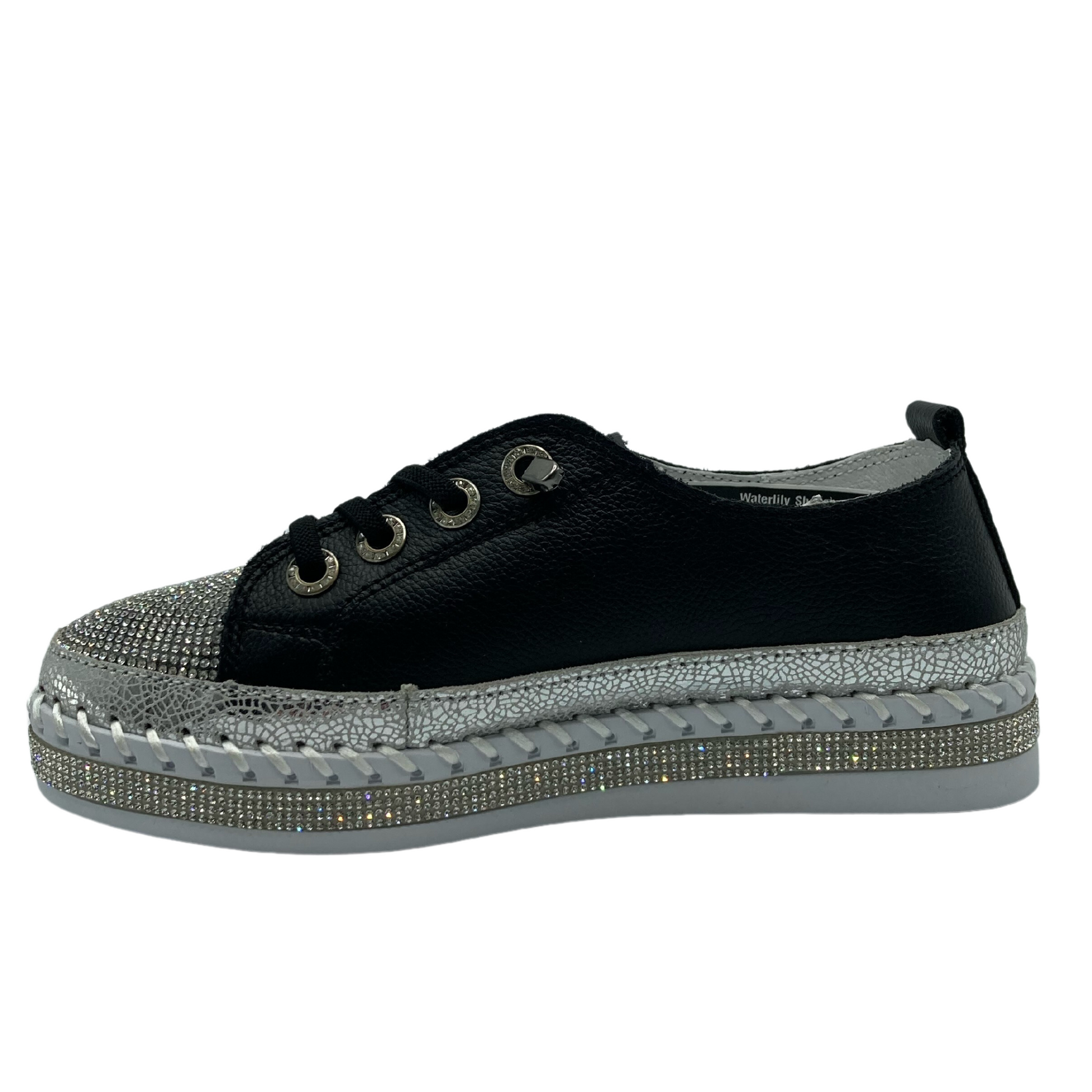 Left facing view of bejewelled platform sneaker with black leather upper