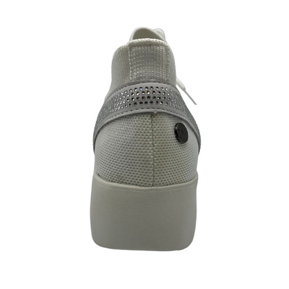 Back view of white mesh sneaker with thick rubber sole and crystal details on the heel
