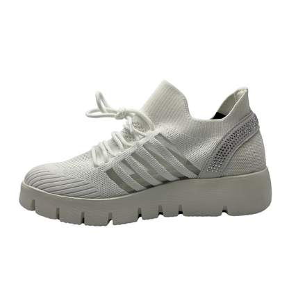 Left facing view of white mesh sneaker with thick rubber sole and crystal details on the heel