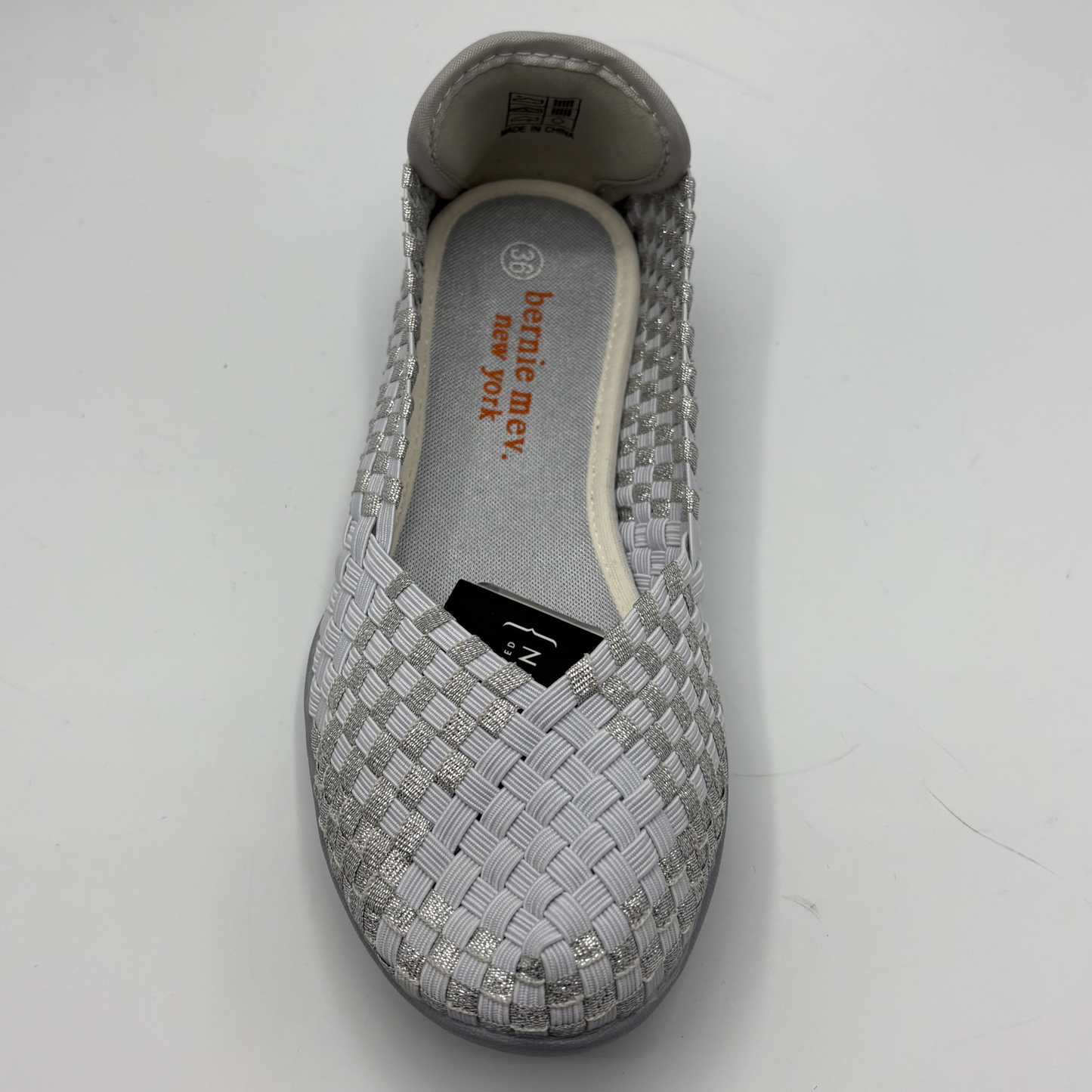 Gray woven shoe with branding on a white background