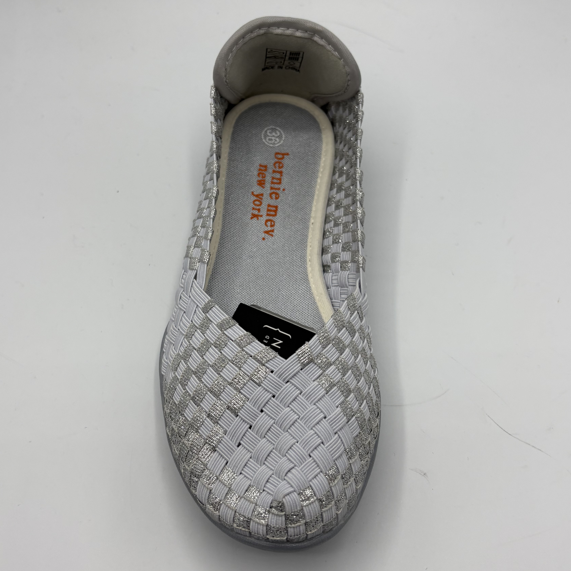 Gray woven shoe with branding on a white background