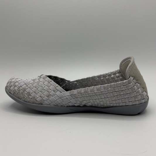 Gray woven flat shoe on a light gray background